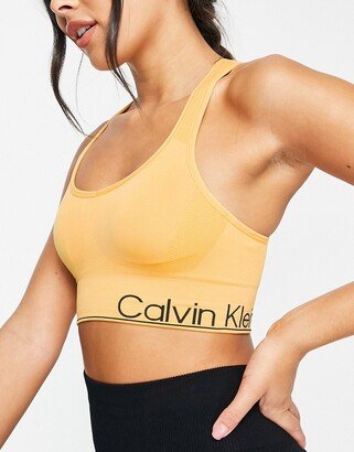 Performance medium impact v-neck racerback seamless sports bra with removable cups in yellow