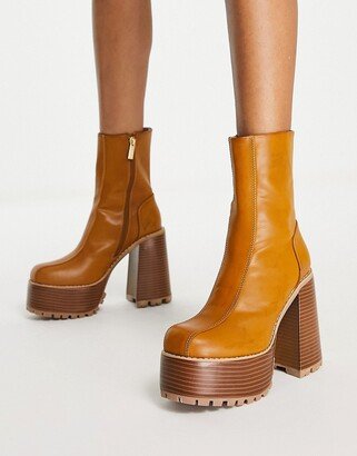 Emotive high-heeled platform ankle boots in tan