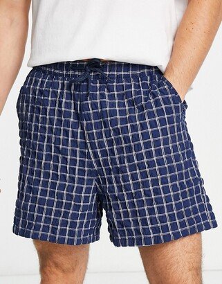 wide shorts in textured navy check