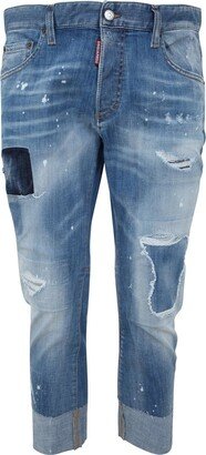 Distressed Mid-Rise Tapered Jeans