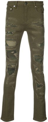 Distressed camouflage panel jeans