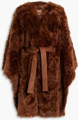 Leather-trimmed shearling cape