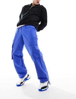 wide leg nylon cargo pants with elastic waist in bright blue