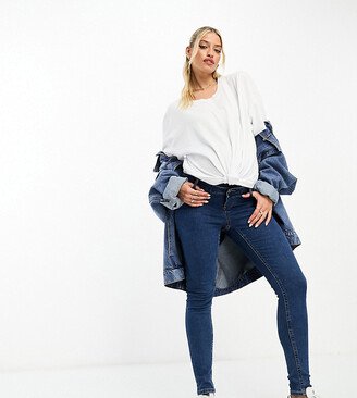 ASOS DESIGN Maternity skinny jeans with over bump in mid blue