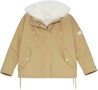 Short reversible parka made from a waterproof technical fabric with lambswool trim