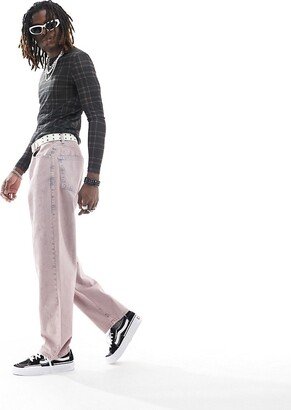 baggy jeans with distressed details in pink acid wash