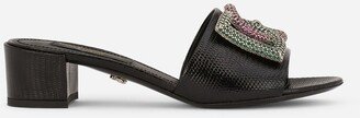 Iguana-print calfskin mules with rhinestone-detailed logo