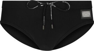 Swim briefs with high-cut leg and branded plate