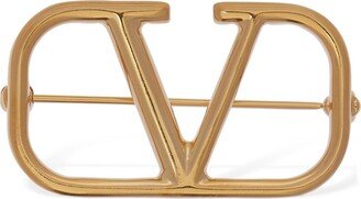 V logo brooch