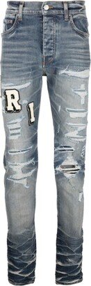 Varsity ripped skinny jeans-AA