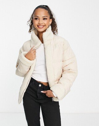 boxy high neck puffer jacket in cream with contrast sherpa panels