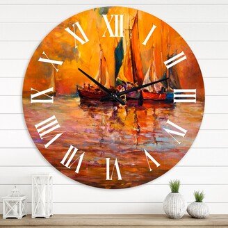 Designart 'Boats On The Ocean During Evening Sunset I' Nautical & Coastal wall clock