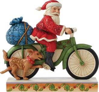 Jim Shore Santa Riding Bicycle Figurine