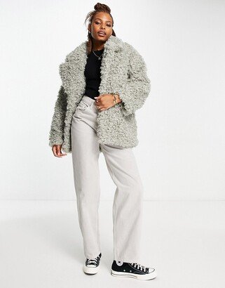 curly faux fur jacket in gray