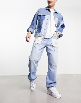 baggy jeans with heavy rips in light wash