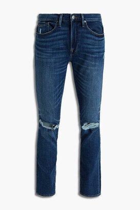 Skinny-fit whiskered distressed denim jeans