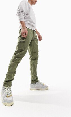tapered cargo pants in sage green with 3D pockets