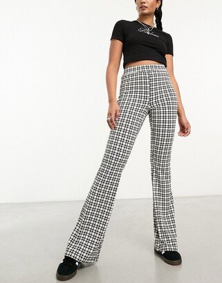 flared pants in black houndstooth
