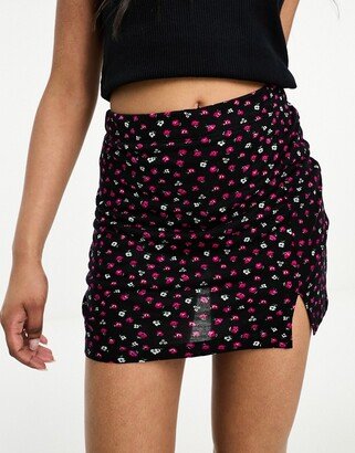 notch front mini skirt in black and red ditsy floral