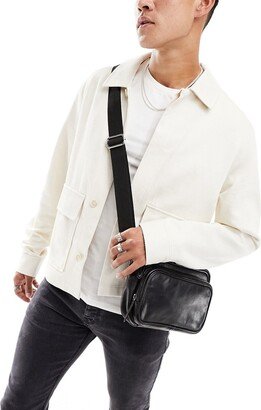 leather crossbody bag with zip pockets in black