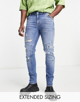 skinny jeans in dark wash with rips and moto detail