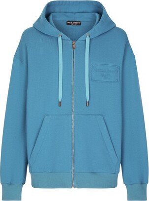 Zip-up hoodie with embossed tag