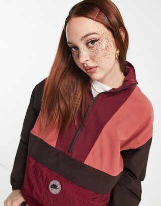 Sports Utility graphic packable quarter zip jacket in beetroot and canyon rust