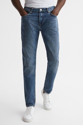 Mid Rise Tapered Jeans