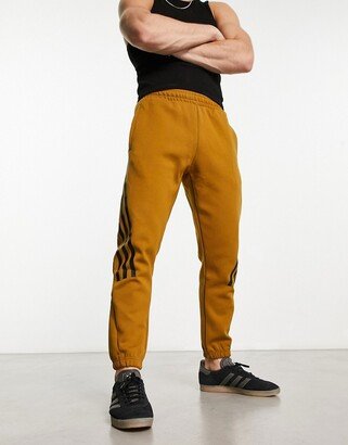 Sportswear Future Icons 3 stripes sweatpants in dark orange