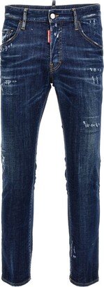 Low-Rise Distressed Tapered Jeans