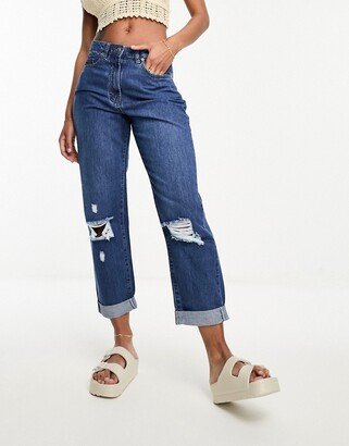 ripped knee boyfriend jeans in mid blue