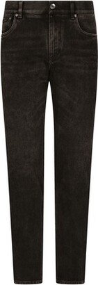 Black skinny jeans with spray-paint print