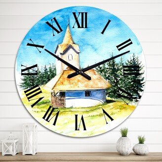 Designart 'Little Village Church In The Pine Trees I' Mid-Century Modern wall clock