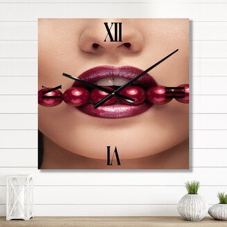 Designart 'Woman With Red Pearls In Mouth In A Sensual Pose' Modern Large Wall Clock