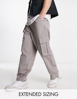 oversized tapered cargo pants in beige with belt