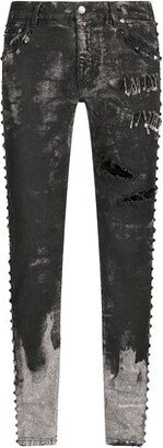 Skinny stretch jeans with studs and safety pins