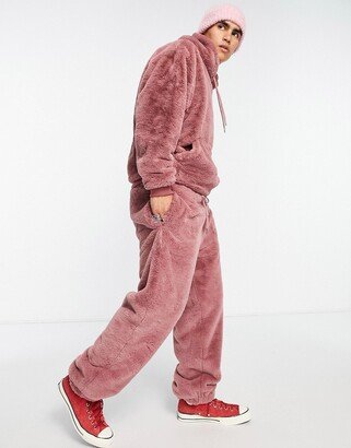 oversized sweatpants in pink faux fur