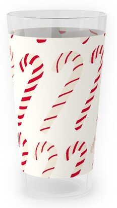 Outdoor Pint Glasses: Dancing Candy Canes Outdoor Pint Glass, Beige