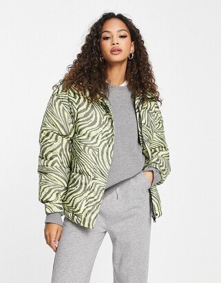 high neck puffer coat in green wavy tiger