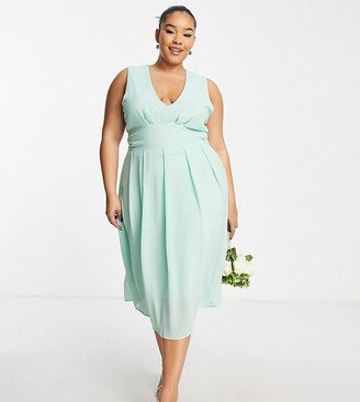 TFNC Plus Bridesmaid chiffon v front midi dress with pleated skirt in fresh sage