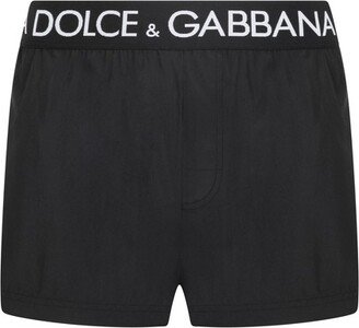 Short swim trunks with branded stretch waistband