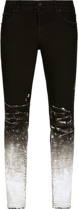 Slim-fit stretch jeans with brushstrokes and logo