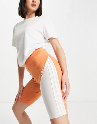 sliced trefoil legging shorts in white and hazy copper