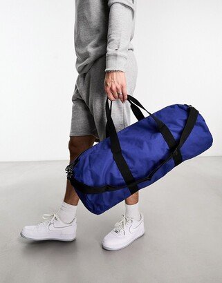 weekend holdall barrel bag in blue nylon with contrast puller