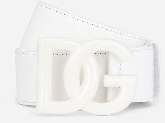 Leather belt with crossover logo buckle