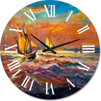 Designart 'Sailships On The Ocean Waves During Orange Sunset' Nautical & Coastal wall clock