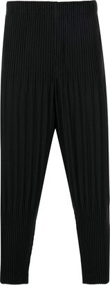 Tapered-Leg Pleated Trousers