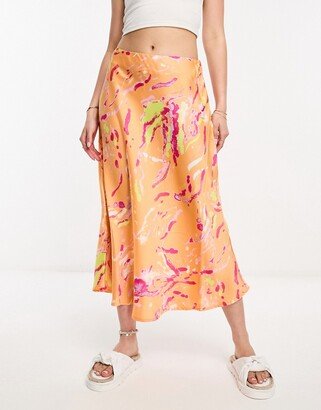 satin midi skirt in orange abstract print