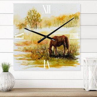 Designart 'Horse Grazing On A Meadow' Farmhouse Metal Wall Clock