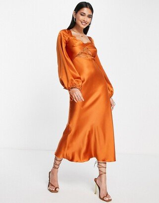 bias satin long sleeve midi dress with delicate lace detail and twist front detail in rust